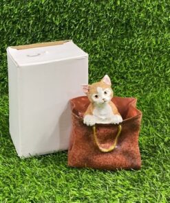 ADORNO CERÁMICO DE GATO EN BOLSO 1UND