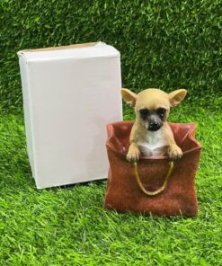 ADORNO CERÁMICO DE PERRO EN BOLSO 1UND