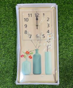RELOJ DE PARED RECTÁNGULO CON DISEÑO FLORERO 20X40CM 1UND