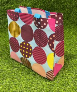 BOLSA REUTILIZABLE DE PUNTOS COLORES 22*23*10 1UND